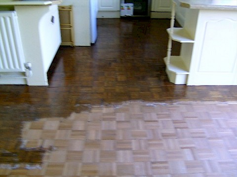 Parquet Kitchen Floor in the process of being sanded